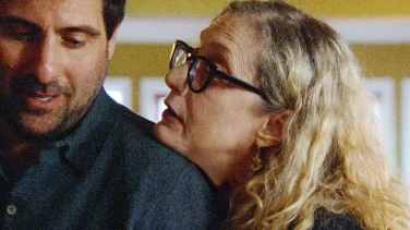 Between the Temples film trailer button