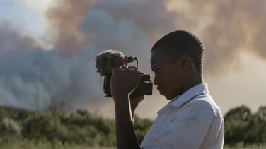 Searching for Amani film trailer button