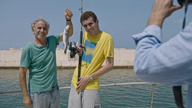 Here We Are film trailer button